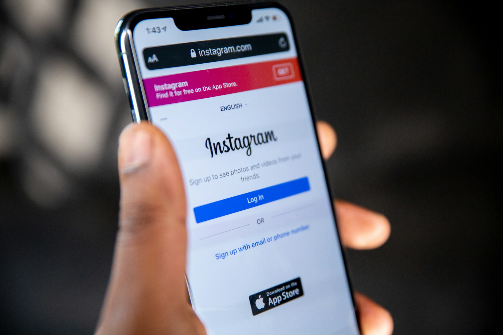 Holding Instagram smartphone app in hand